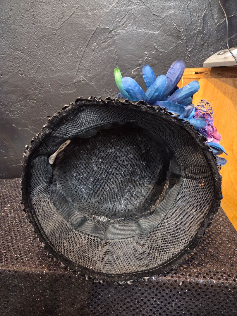 Black Basket Weave Hat with multiple flowers and teal and rhinestone hat band