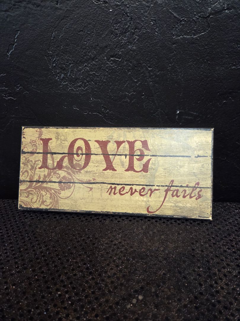 Love never fails Sign
