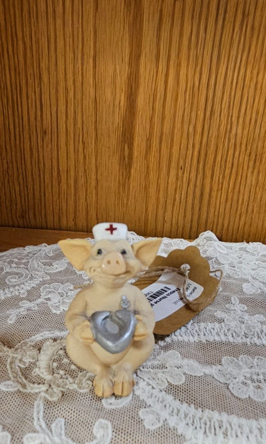 Enesco Nurse pig with bedpan LR