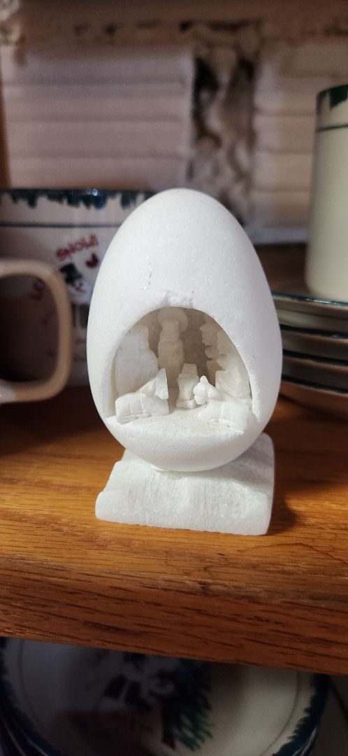 Stone carved nativity set in egg shape