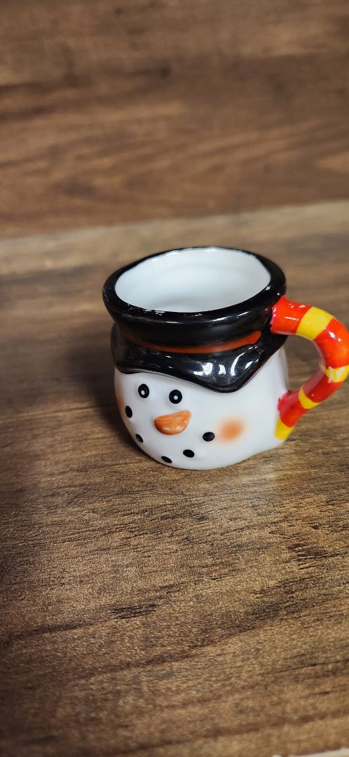 Tiny ceramic snowman mug