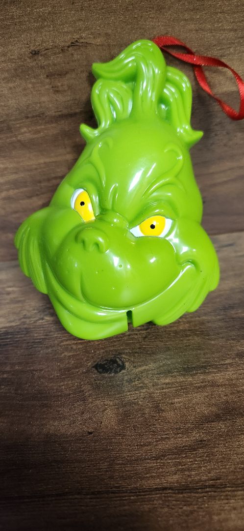 green Grinch head plastic ornament