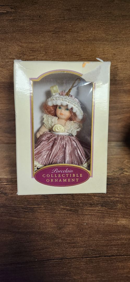 Porcelain collectible doll ornament - mauve dress