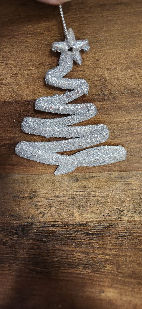 Silver glitter tree with star ornament