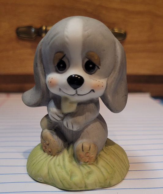 1970's puppy holding a bone
