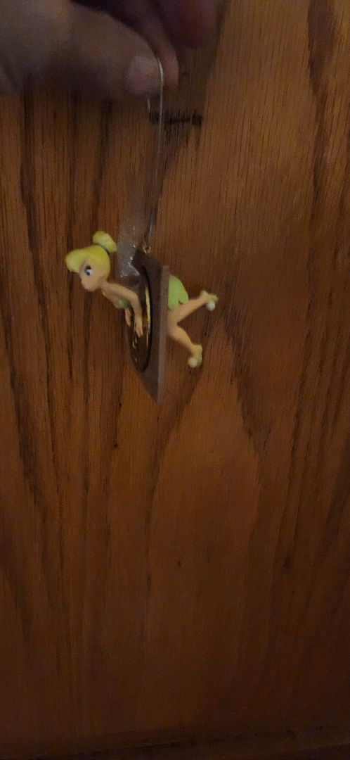 Disney Tinkerbell flying through a keyhole ornament
