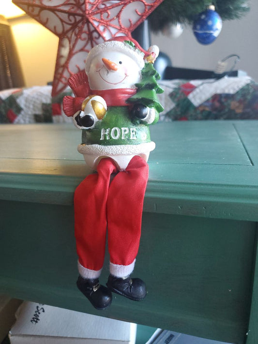 Ledge sitting snowman