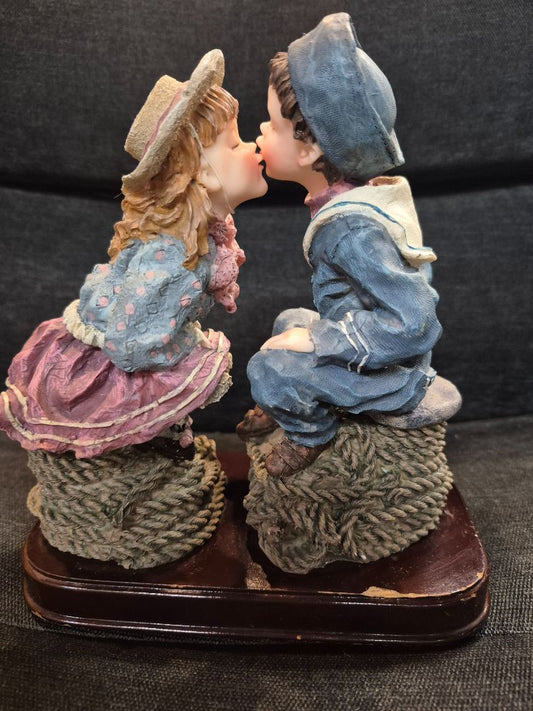 Meerchi Sailor boy & girl kissing on rope seats, 7" x 8"