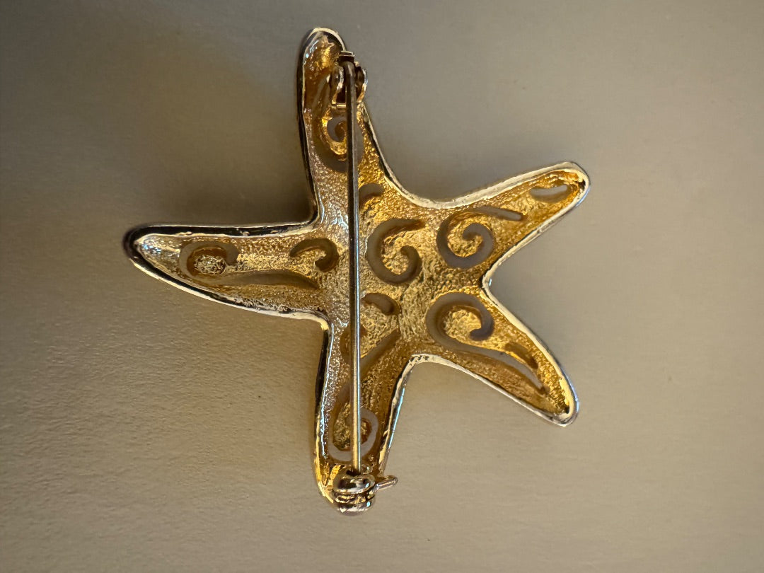 Goldtone cutout starfish brooch