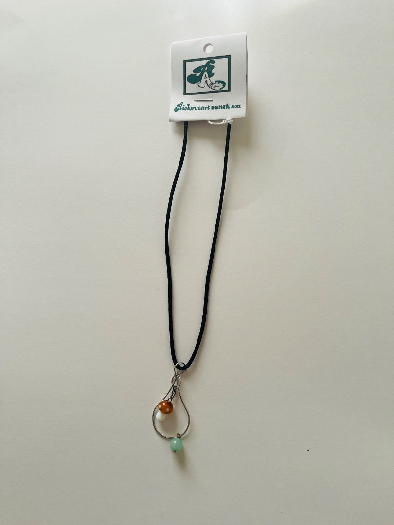 Adjustable Cord with Glass Mushroom dangling on tear drop with glass bead. Jewelry