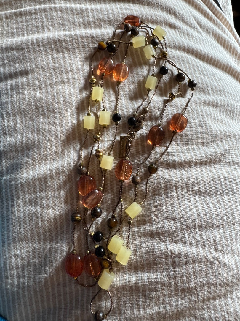 Daisy Fuentes long amber/cream necklace