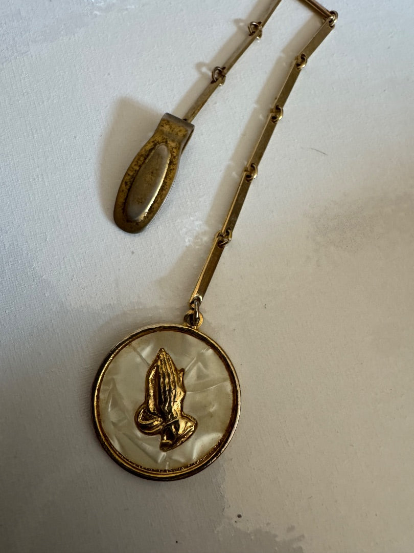 Praying hands gold tone clip
