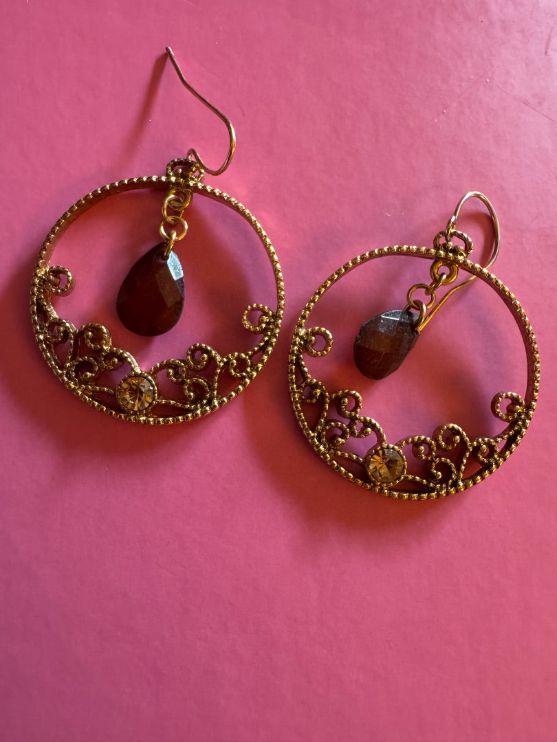 Gold tone circle w/dark red accent dangle earrings