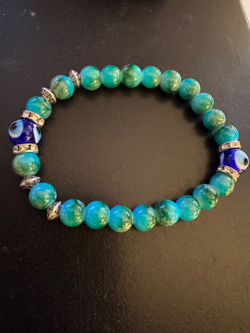 Green with blue evil eye stretchy bracelet