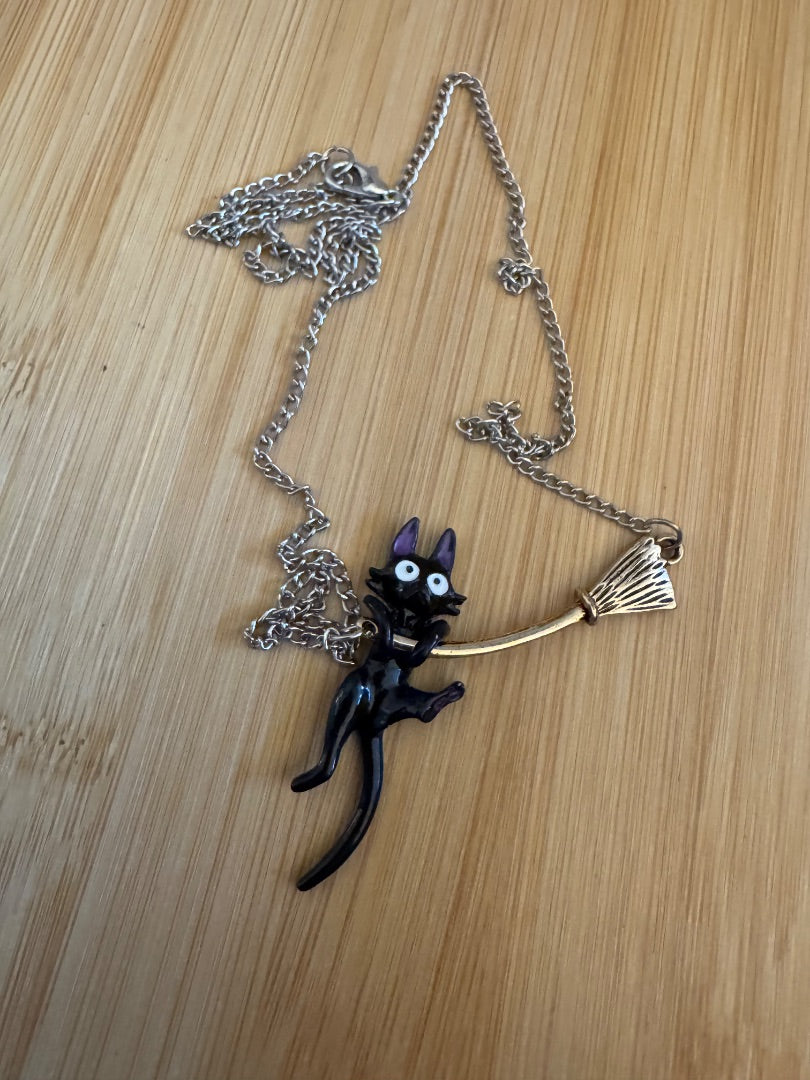 Black cat on broom silver tone necklace