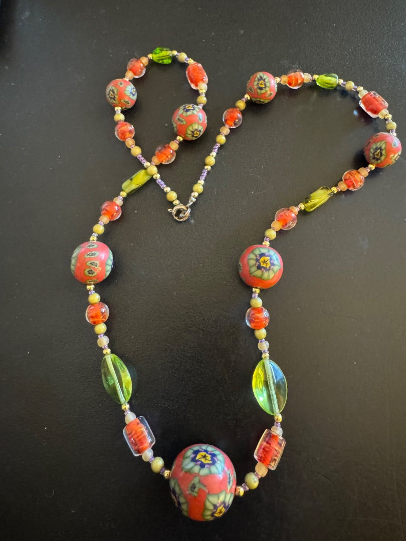 Orange patterned beads/lime green accent necklace