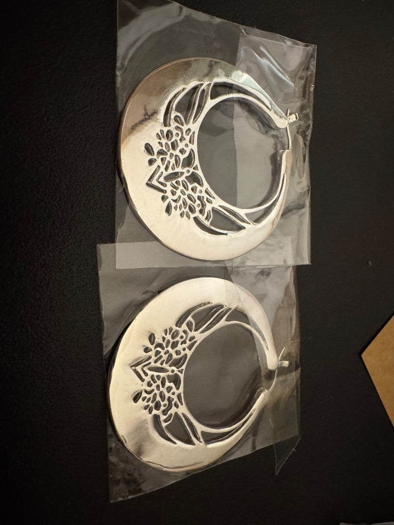 Silver tone butterfly cutout crescent earrings
