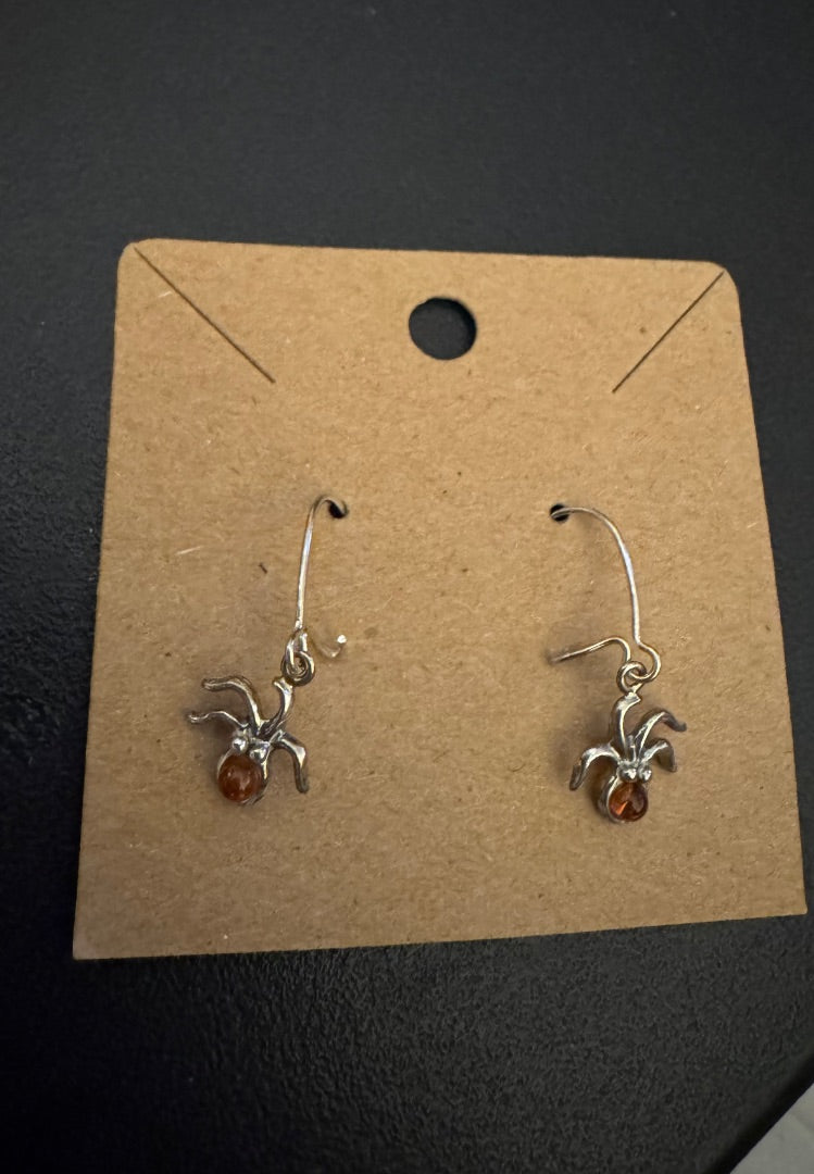 Amber silver tone spider dangle earrings