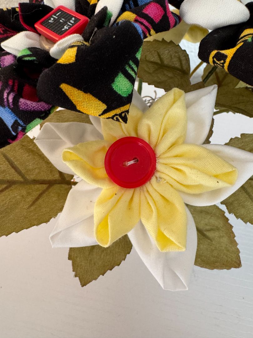 Yellow, white, blue, green, red and black Upcycled hand made flower bouquets, 7" high x 7" wide