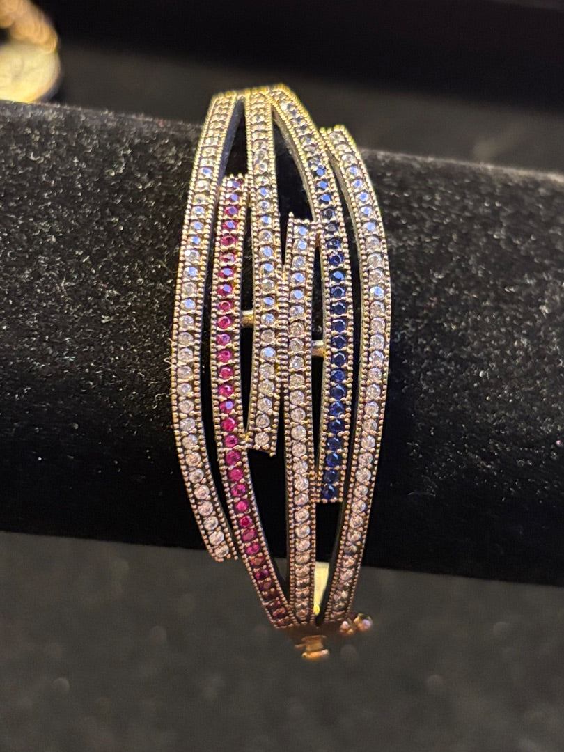 Red Hinged bangle with Ruby and sapphire stones