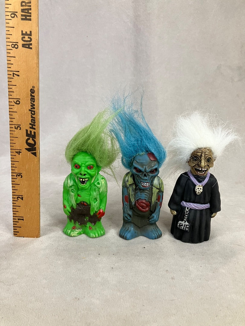 3 small character zombies they play sound but with out batteries currently