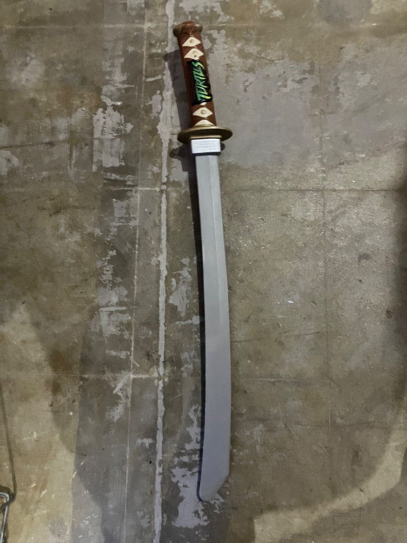 Vintage Ninja Turtle Sword Plastic . Makes sword cutting sounds.