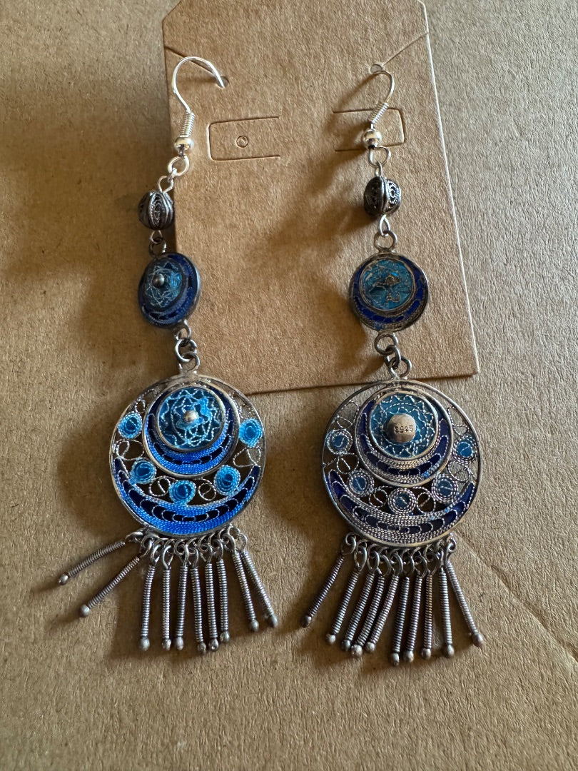 Long blue silvertone dangle earrings