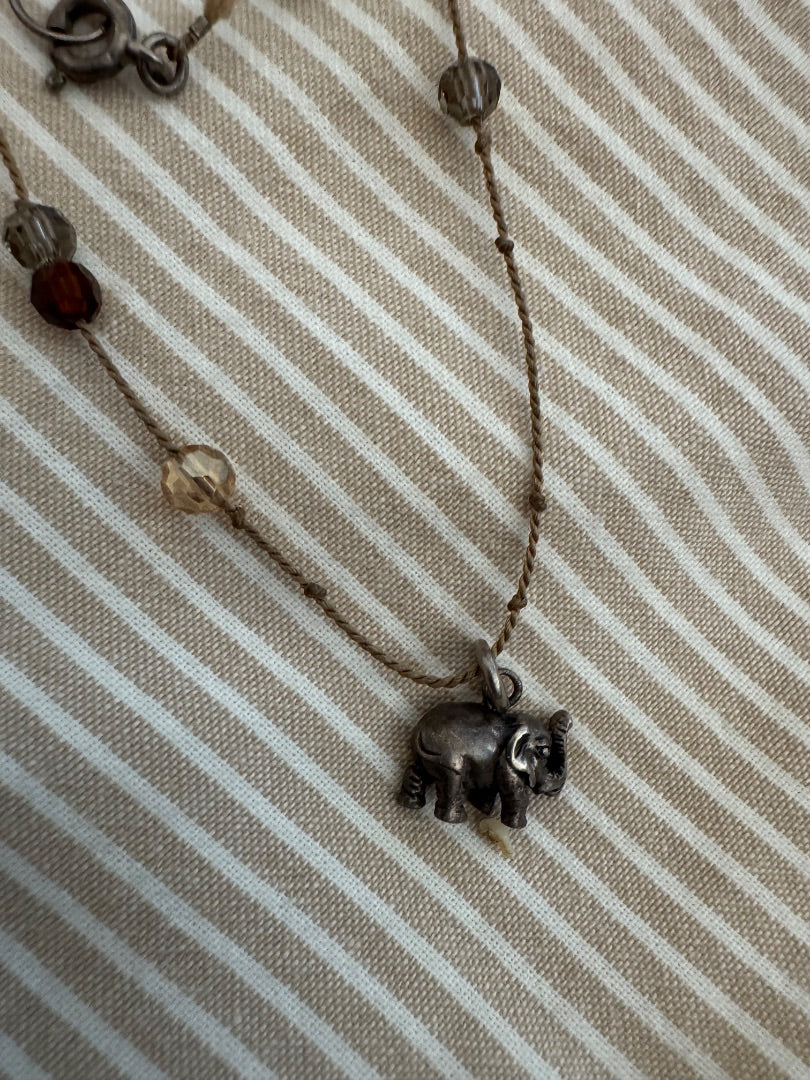 Silvertone red accent elephant necklace