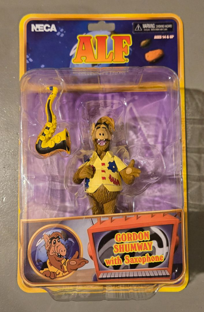 Neca Alf with Saxophone
