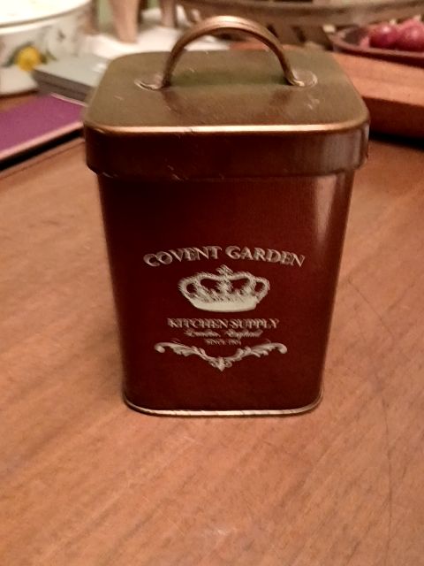 Brown metal kitchen canister, 4" x 5"