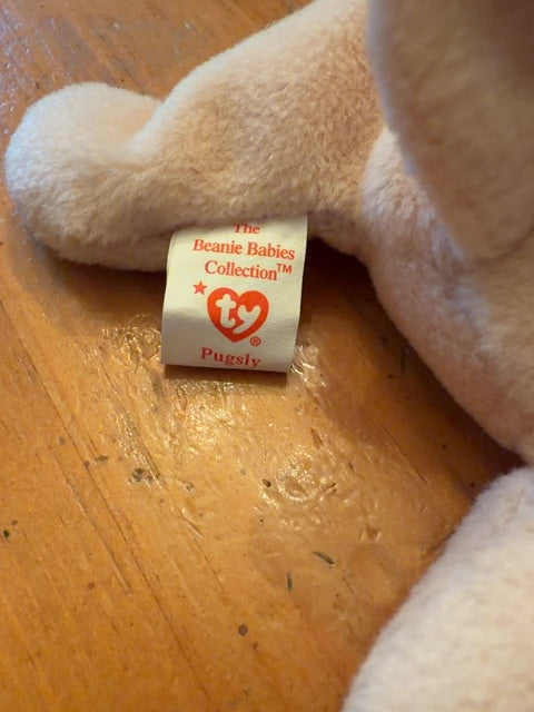 Beanie Baby Pugsly. Has paper tag.