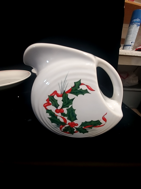 Fiestaware Small pitcher with holly and ribbon