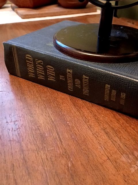 Vintage hard cover book 1964 "who's who", 8" black globe