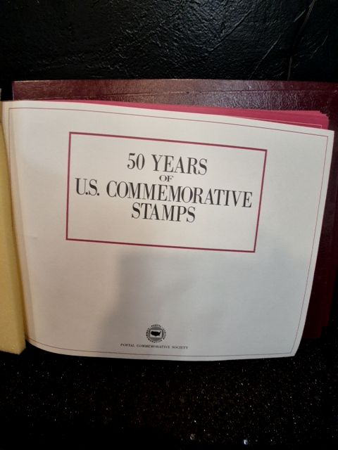 Burgandy United States Postal Service 50 Years of US Commemorative Stamps (2 Albums), 16" × 11.5"