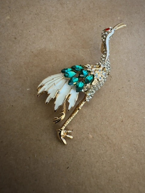 Crane white green gold tone brooch