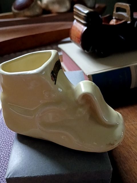 Yellow McCoy Vintage yellow ceramic baby shoe 2.5" x 4.5"