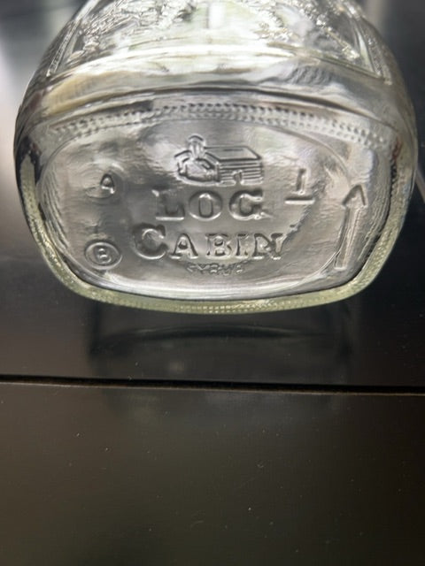 Vintage log cabin “drummer boy” bottle