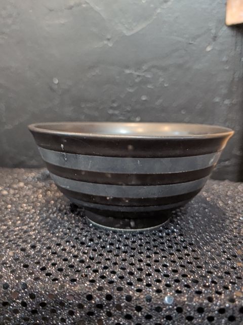 Black bowl w/ strip pattern