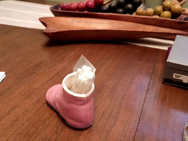 Vintage pink ceramic baby shoe Q tip holder