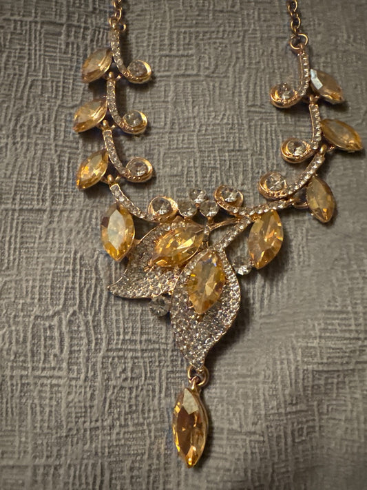 Yellow and gold stunning rhinestone necklace and earrings. Unknown Gold rhinestone set