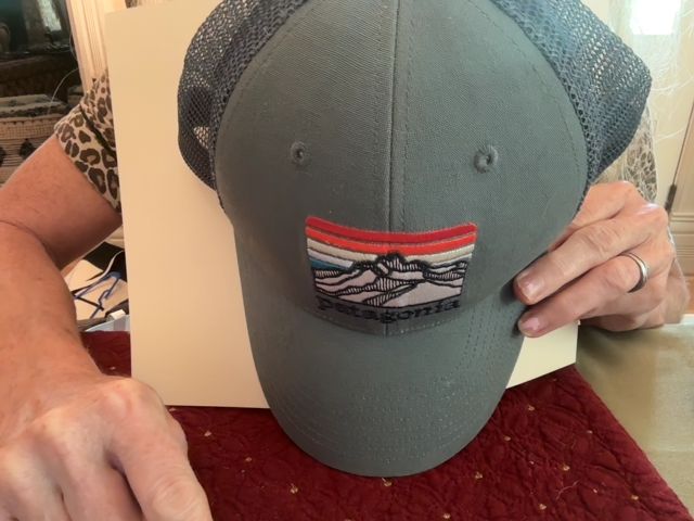 Grey Patagonia Trucker Hat, snap closer