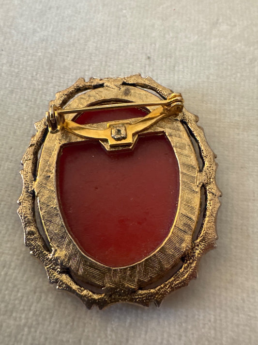 Cameo in gold bamboo frame.