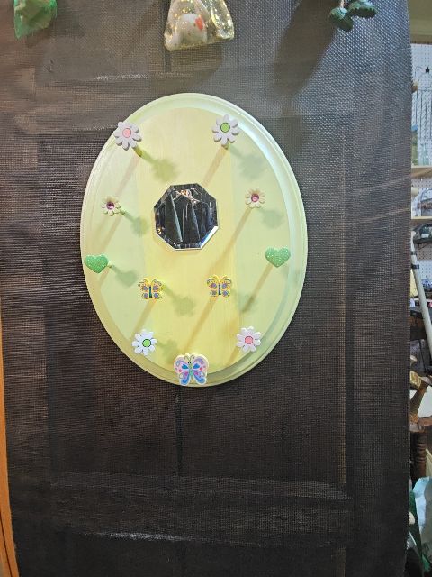 Yellow hanger with mirror
