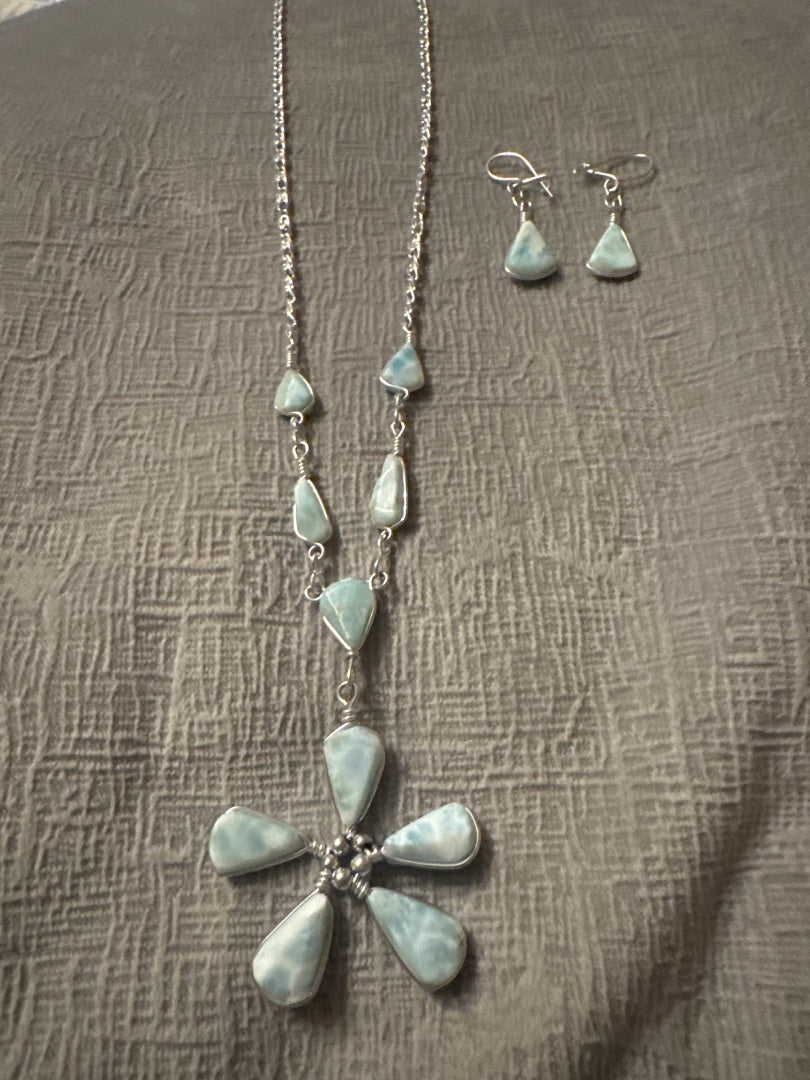 Light blue and silver Unknown Light blue necklace and earring set. Jewelry