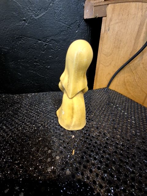 Yellow Painted Ceramic Nun, 2.5" × 4.75"