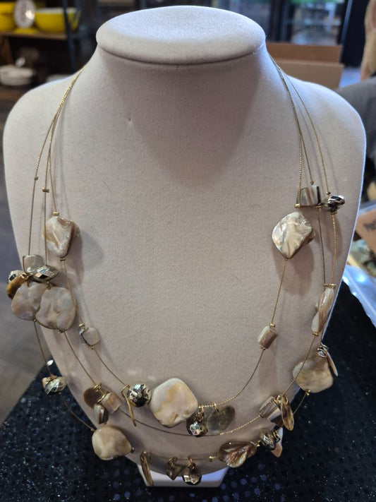 Gold toned multi strand necklace with shells