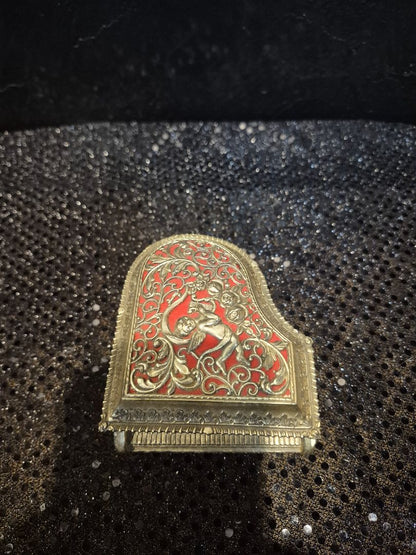 Vintage Gold Toned filigree Piano music/trinket box Cherub with red liner