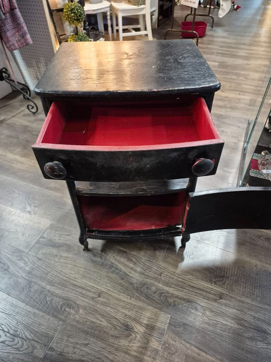 Black Wood Cabinet with Red painted inside. 1 Drawer with door shelf on bottom