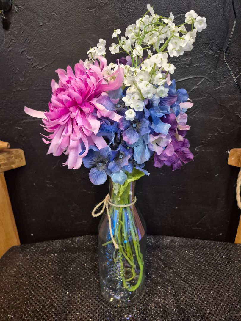 Silk Flowers in a Glass Bottle