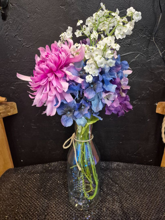 Silk Flowers in a Glass Bottle